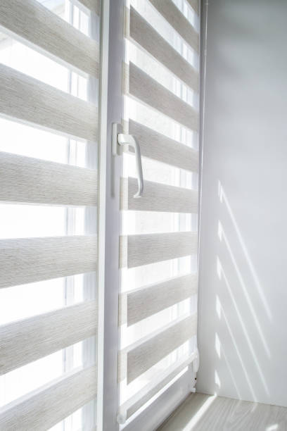 istock Window roller duo system day and night. Close up on roll curtains indoor. 1399705384