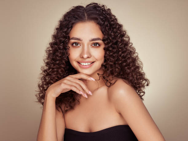 istock Beautiful smiling woman with afro curls 1399707137