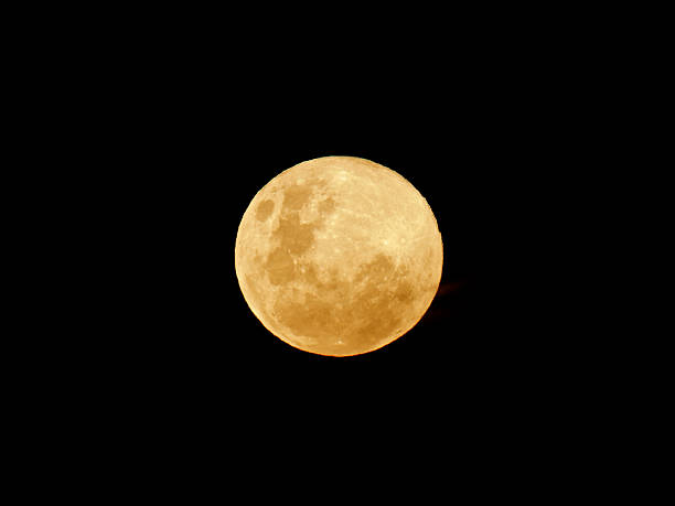 istock Large, full, yellow moon against a dark sky 139970776