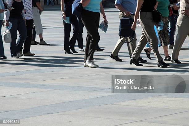 Crowd Of Pedestrians Moving Along The Sidewalk Stock Photo - Download Image Now - Blurred Motion, Crowd of People, Spectator