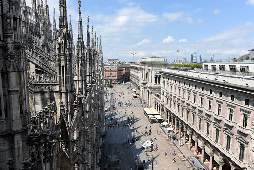 Exterior of the Milan Cathedral (Duomo di Milano). The image shows partially the gothic features of this extraordinary building. The construction began in 1386, and the final details were completed in 1965.