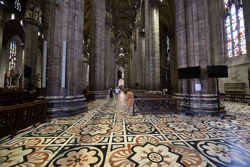 Inside the Milan Cathedral (Duomo di Milano). The image shows the huge columns of this extraordinary building. The construction began in 1386, and the final details were completed in 1965.