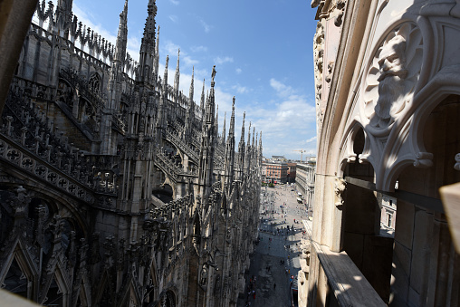 Exterior of the Milan Cathedral (Duomo di Milano). The image shows partially the gothic features of this extraordinary building. The construction began in 1386, and the final details were completed in 1965.