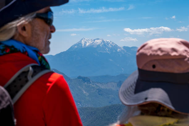 close-up. male 60 years old female 55 years old snowy mountains enjoying wide panoramic view active lifestyles with high vitality