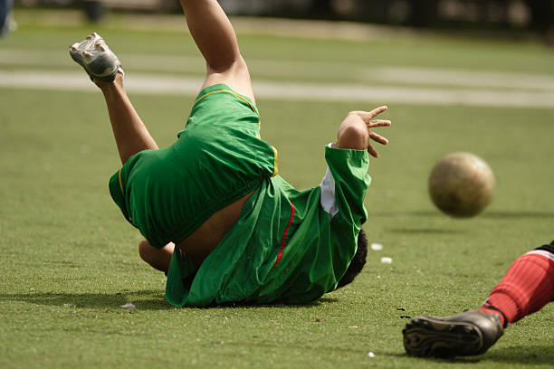 Soccer foul A player is fouled. foul stock pictures, royalty-free photos & images
