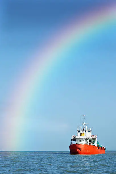 rainbow and a red ship