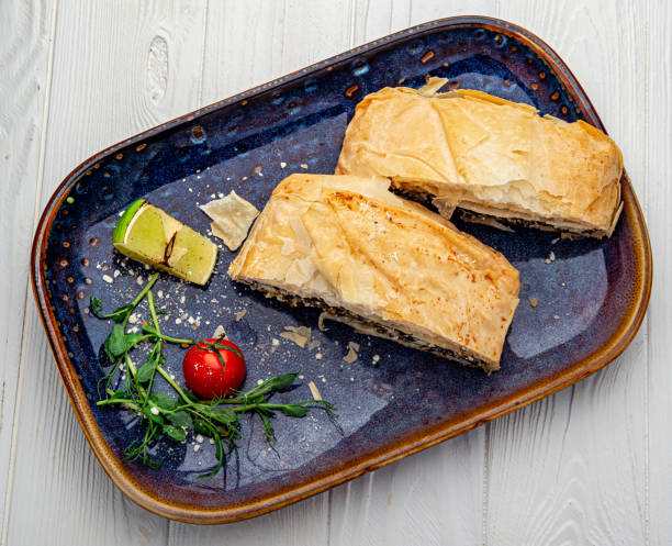 istock Homemade puff pastry pie with spinach and cheese. 1399715501