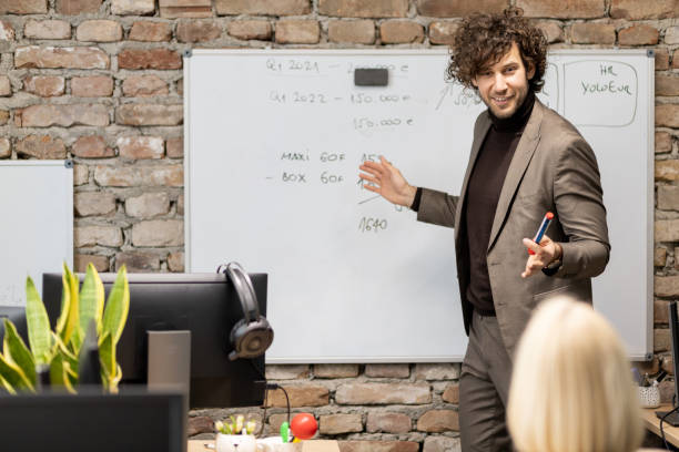istock Young businessman giving a presentation at work 1399715597
