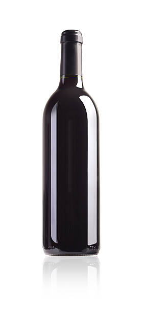 Dark bottle of red wine on white background stock photo