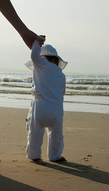 sweet girl looking at the beach stock photo