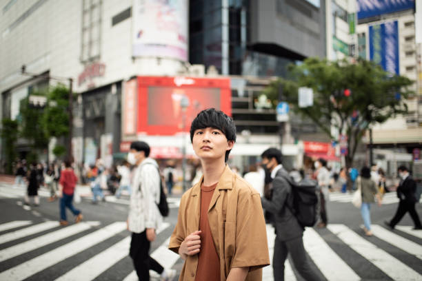 istock Crowd of people and a young man 1399721484