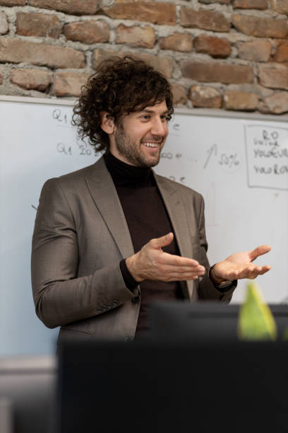 istock Young and ambitious businessman holding a presentation at work 1399723886