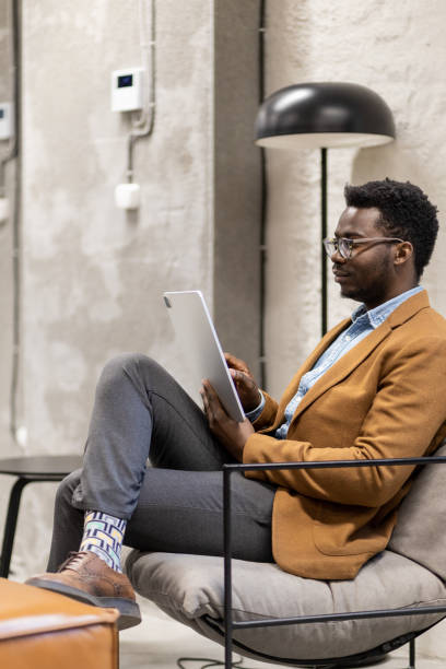 istock Young and modern black business owner using his iPad 1399724642