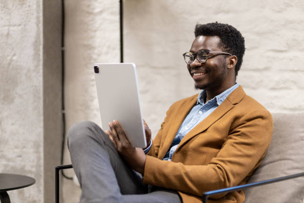 istock Young black businessman on a video call on his tablet 1399725160