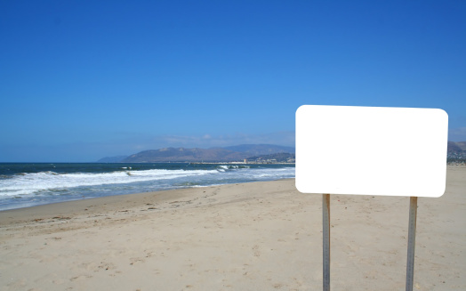 A blank sign on a California beach.