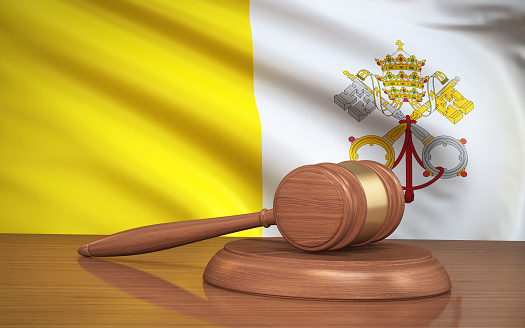 3d Render Judge Gavel and Vatican City flag on background (close-up)