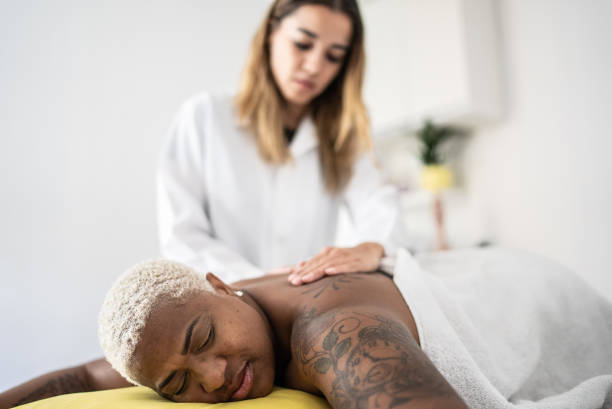 istock Mature woman getting massage at spa 1399726683