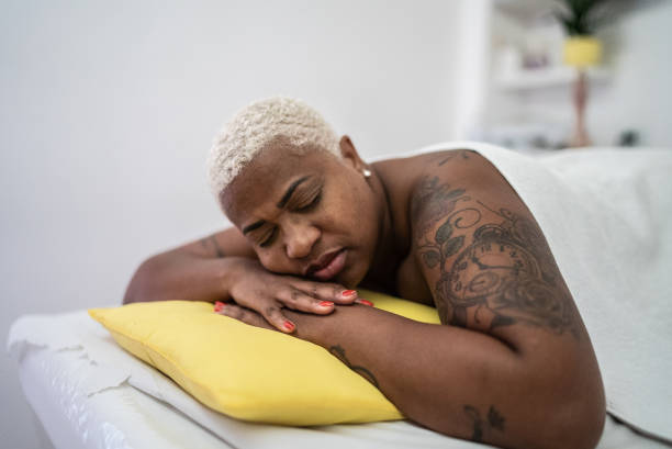 istock Mature woman relaxing with eyes closed at spa 1399726686