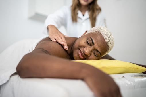 Mature woman getting massage at spa