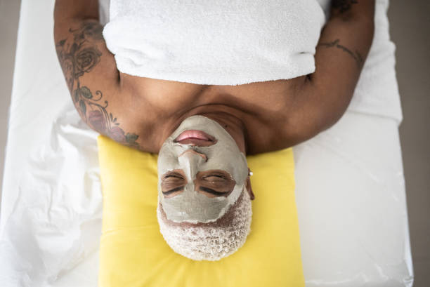 Mature woman doing a facial treatment at a spa