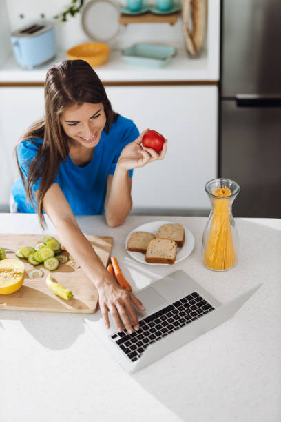 istock Woman searching recipes over Internet in the kitchen 1399728678