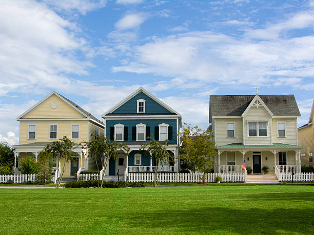 Small Town America charming neighborhood with vintage styled cottages in small American town victorian houses exterior stock pictures, royalty-free photos & images