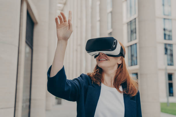 istock Redhead businesswoman managing business project through virtual reality platform 1399733325