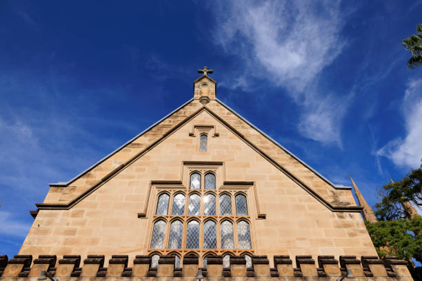 Part of an old church with deep blue sky behind.