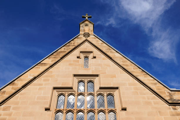Part of an old church with deep blue sky behind.