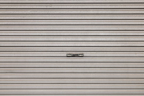 Metal garage door with repeating pattern.