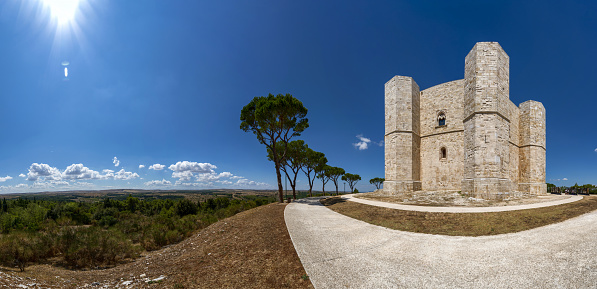 Andria, Puglia, Italy. August 2021. Amazing large format photo of Castel del Monte. Beautiful summer day with white clouds. Copy space.
