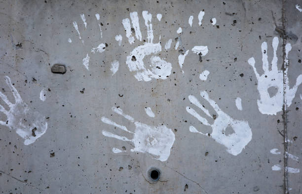 istock hand print painted on concrete wall background 1399737229