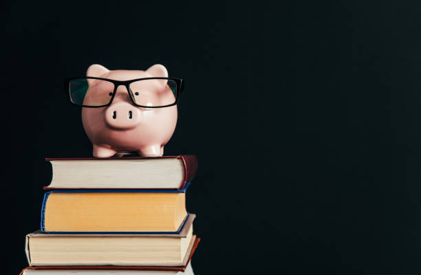 istock Piggy bank on a stack of books. 1399737859