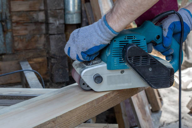 istock A man grinds wooden boards with a grinder. Woodwork, carpentry, hobby. 1399737900