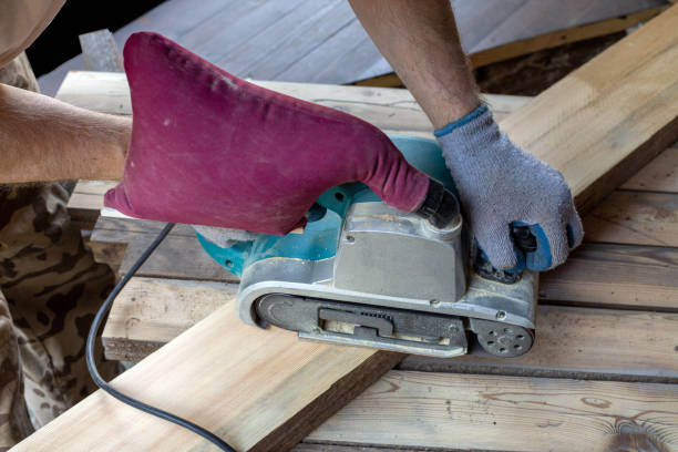 istock A man grinds wooden boards with a grinder. Woodwork, carpentry, hobby. 1399737909
