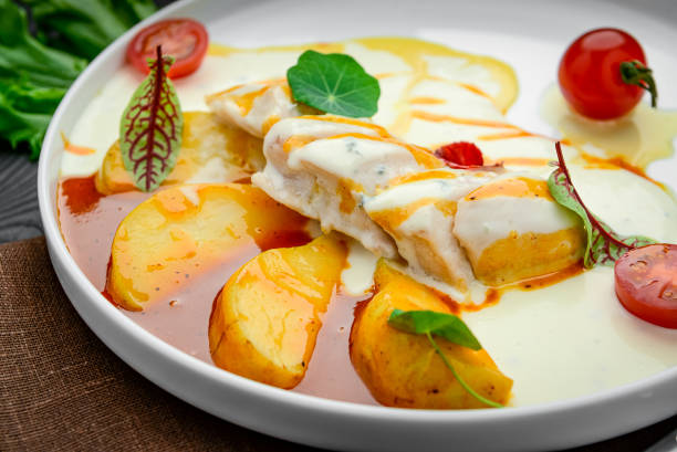 istock Chicken fillet in a creamy sauce with caramelized pear 1399741987