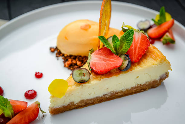 istock cheesecake with berries and sorbet on plates 1399742027