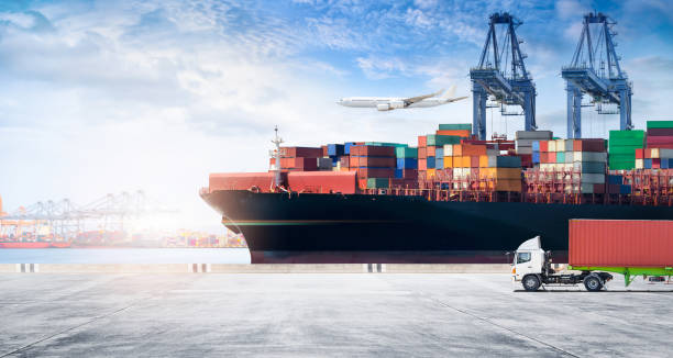 istock Container cargo freight ship during discharging at industrial port move to container yard by trucks, handlers, cargo plane, copy space, logistic import export background and transport industry concept 1399746184
