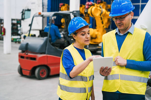 istock Engineers working inside robotic factory - Industrial and technology concept - Focus on senior woman face 1399747224