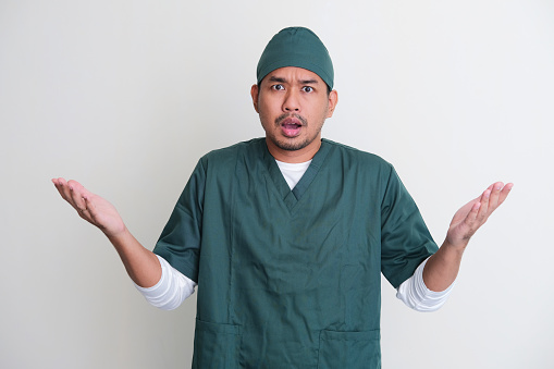 Asian hospital nurse showing confused expression