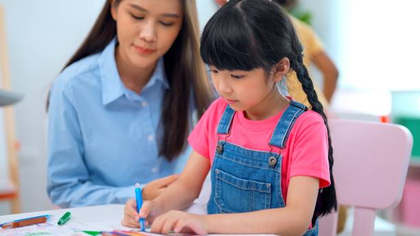 istock kindergarten, school girl, classroom, education, learning, knowledge 1399748303