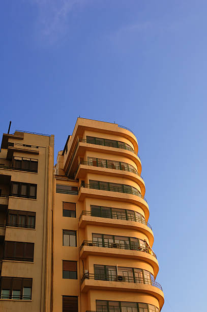 istock high contrast orange building with blue sky 139974930