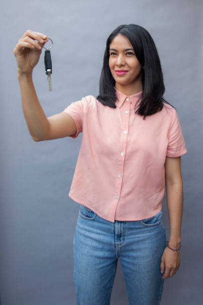 istock woman holding car keys 1399751416