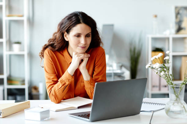 istock Woman Watching Presentation On Laptop 1399752372