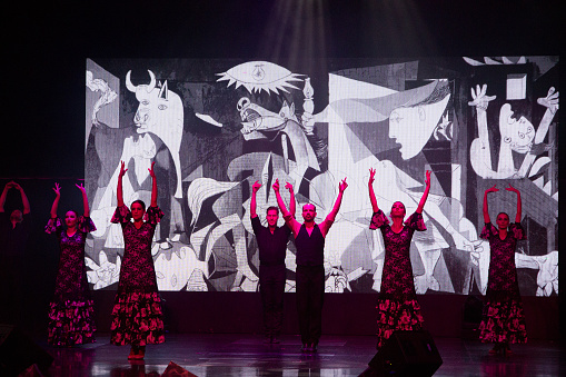 Drag queens doing a dance performance in a theater play