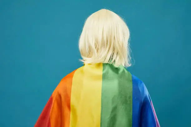 Photo of Person Wearing Rainbow Flag
