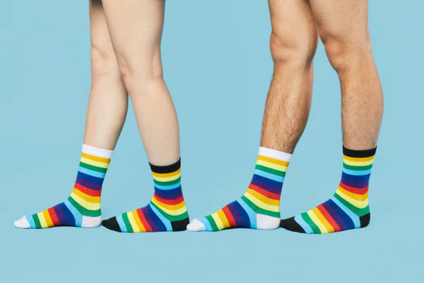 istock Playful Couple Wearing Different Socks 1399753820