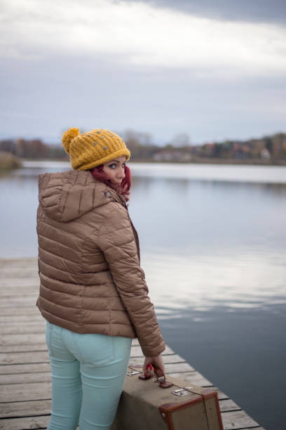 istock female passenger with suitcase on lake 1399753983