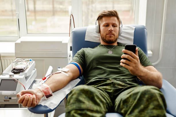 istock Soldier Donating Blood in Comfort 1399755066