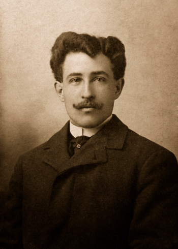 antique photograph of man in suit coat with moustache